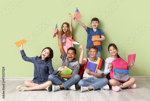 Pupils of language school near color wall