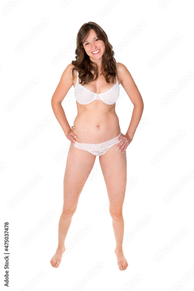 Full length portrait of a young happy woman wearing white underwear, isolated in front of white studio background Full length portrait of a young happy woman wearing white underwear, isolated in front of white studio background