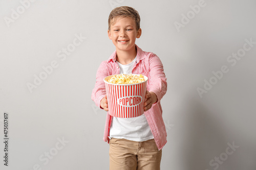 Smiling little boy with buc...