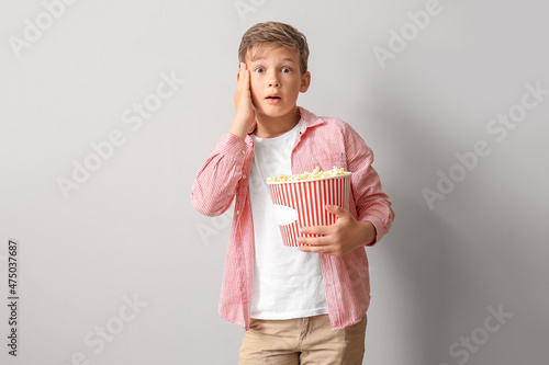 Shocked little boy with buc...