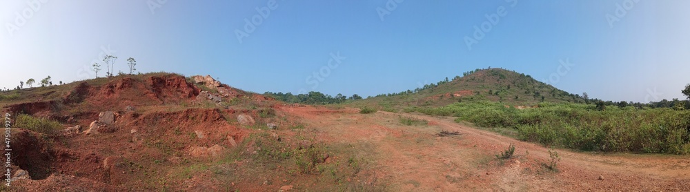Red clay hills, here the whole hill is red clay with this soil the raw house is painted.