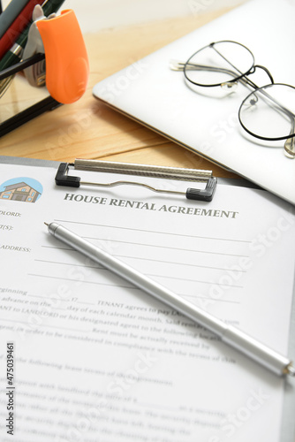 Wallpaper Mural House rental agreement with pen, laptop and eyeglasses on table in office, closeup Torontodigital.ca