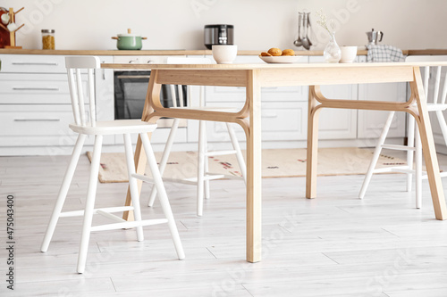 Table and chairs in modern kitchen