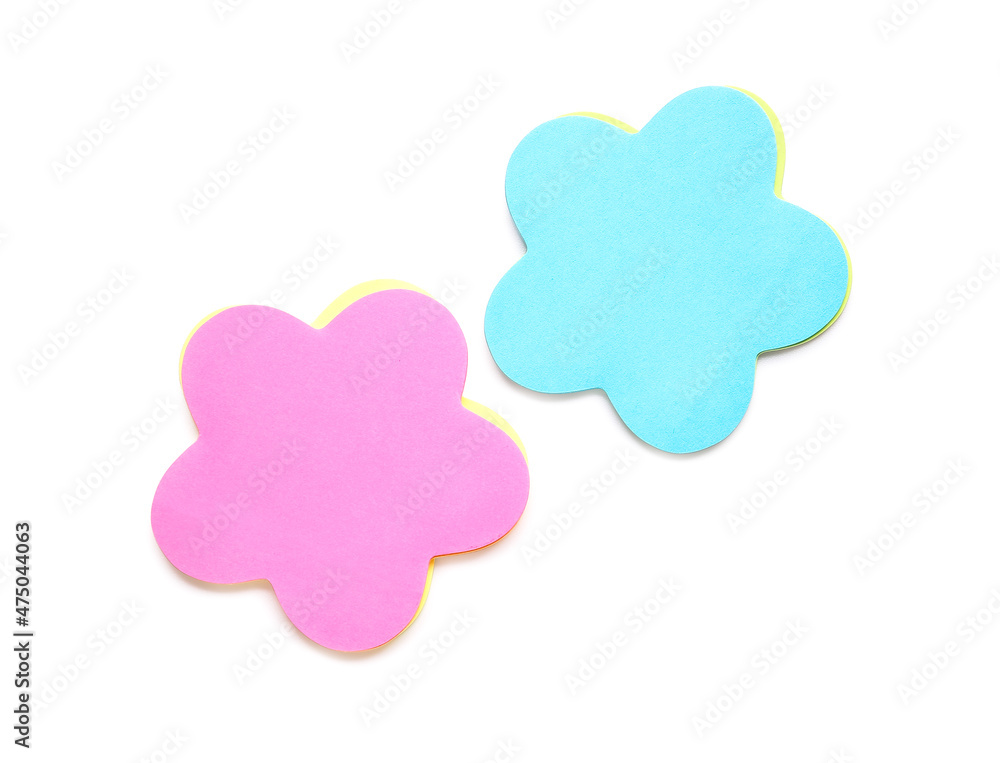 Colorful sticky notes in shape of flowers on white background