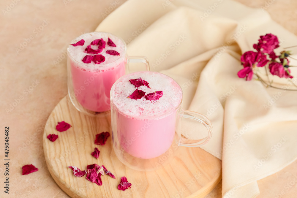 Cups of tasty rose latte on table Cups of tasty rose latte on table