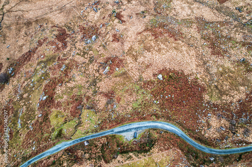 Aerial view of a car parked at the Black Valley, located in county Kerry, south of the Gap of Dunloe and north of Moll's Gap, in Ireland photo