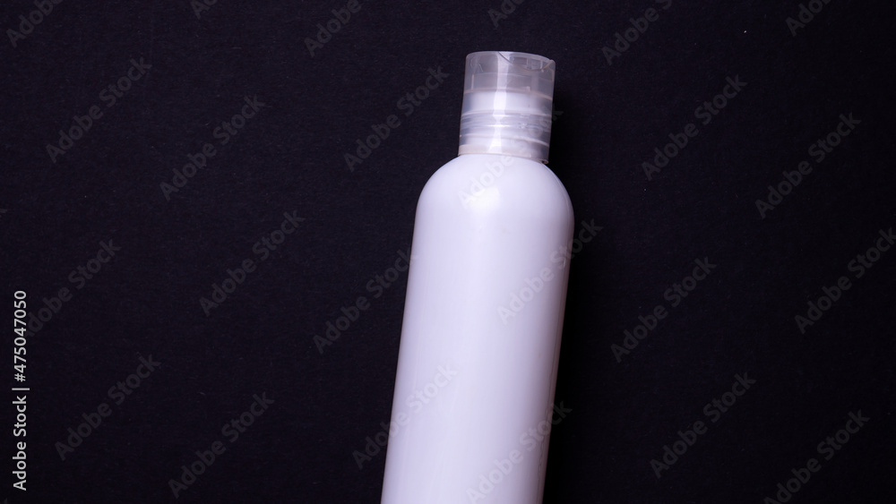 shampoo or hair conditioner bottle isolated on black background shampoo or hair conditioner bottle isolated on black background