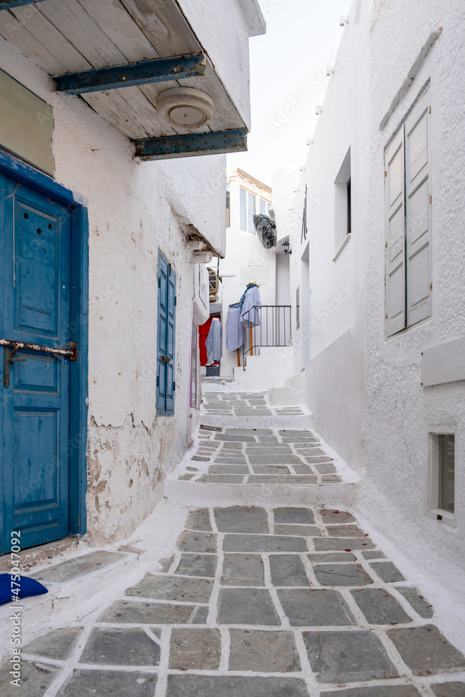 Cyclades, Greece. Ios, Nios island, Chora. Whitewashed buildings and narrow cobblestone alley.
