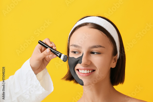 Cosmetologist applying acti...