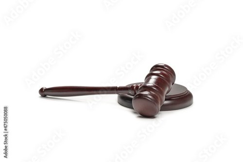 Wooden judge gavel and soundboard isolated on a white background.