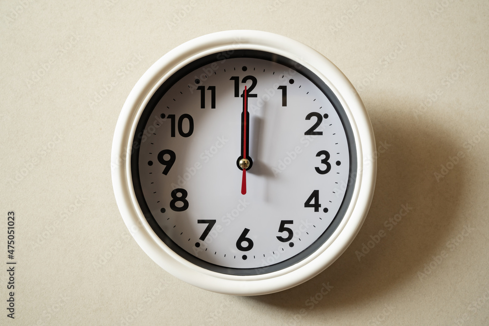 a Wall clock at midday a Wall clock at midday