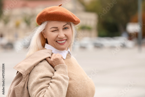 Fashionable mature woman in...