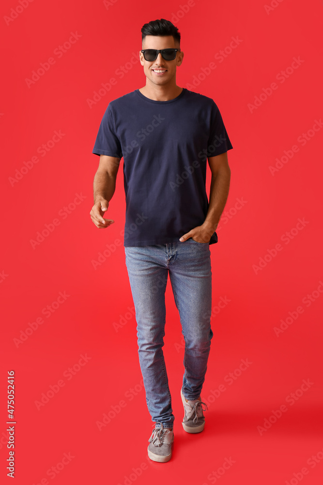 Handsome young man in stylish t-shirt on color background Handsome young man in stylish t-shirt on color background