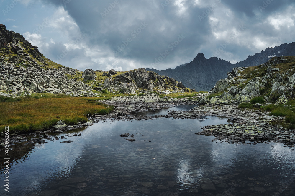 Lake under the Kynkhara pass, tourist resort of Arkhyz. Lake under the Kynkhara pass, tourist resort of Arkhyz.