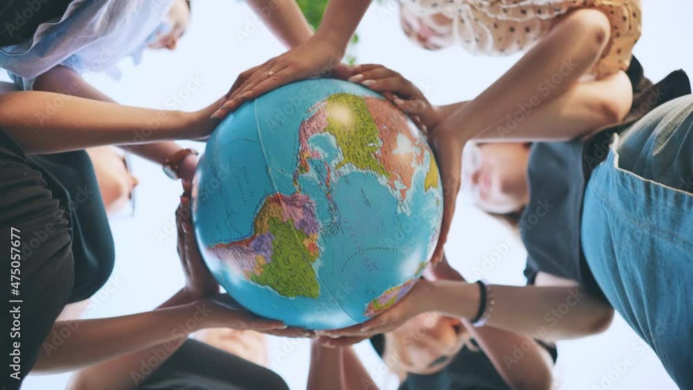 Girlfriends are holding a globe in the center of the circle. Girlfriends are holding a globe in the center of the circle.