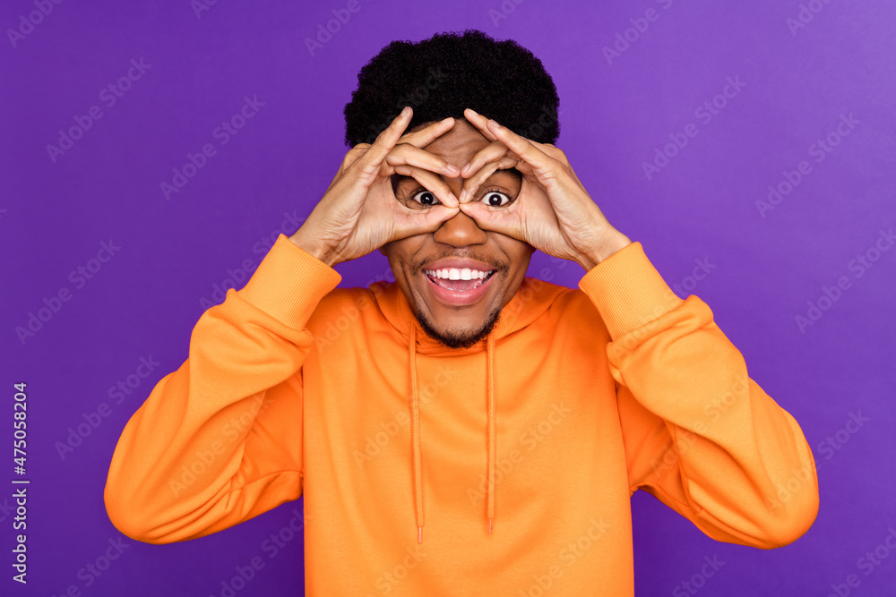 Photo of brunette cheerful young afro american happy man make fingers glasses okay isolated on purple color background Photo of brunette cheerful young afro american happy man make fingers glasses okay isolated on purple color background