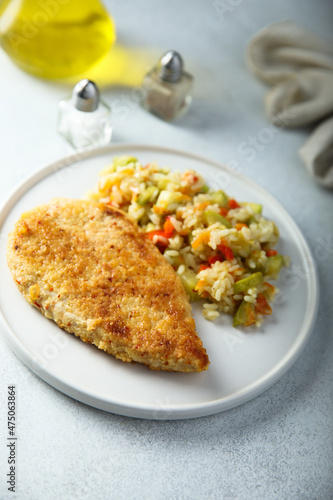 Homemade chicken schnitzel with rice and vegetables