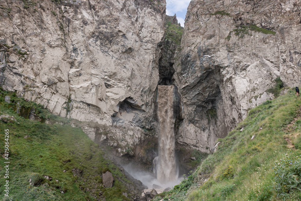 Sultan Waterfall in Kabardino-Balkaria, Russia. Close-up of a large turbulent flow of water in the river. A mountain river carries its waters posing a danger to careless actions. 