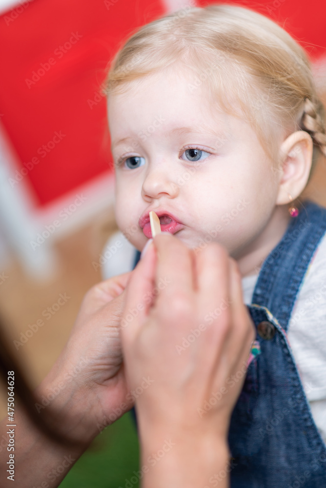 Woman speech therapist helps girls correct her speech Woman speech therapist helps girls correct her speech