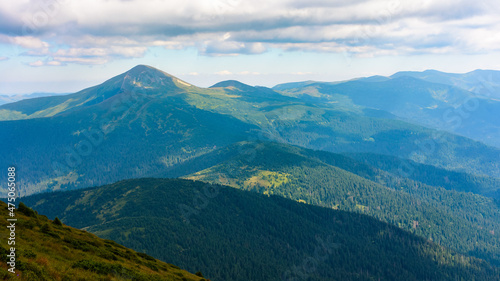 Wallpaper Mural mountainous nature landscape in summer. scenic travel outdoor background. view in to the distant chernohora ridge with Hoverla peak and clouds on the sky above hirizon Torontodigital.ca