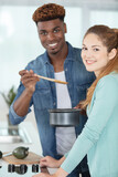 beautiful young couple preparing a healthy meal together
