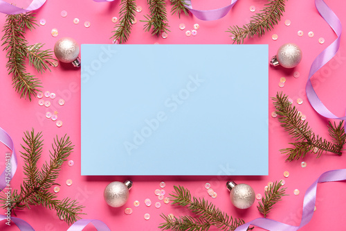 Blank card and Christmas decor on pink background