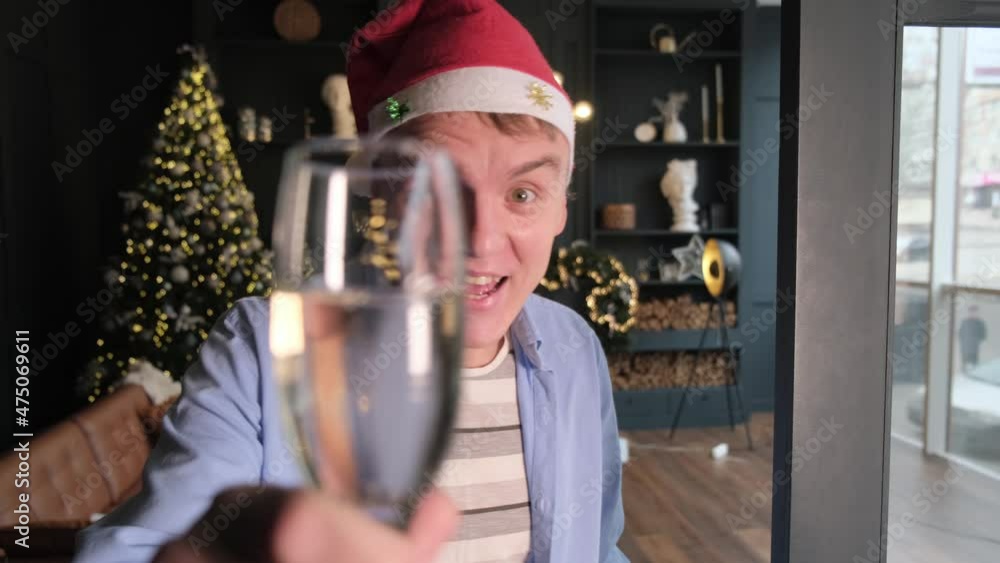 POV of a happy man chatting online for christmas with friends or subscribers. Video blogger wishes subscribers a merry Christmas via video chat POV of a happy man chatting online for christmas with friends or subscribers. Video blogger wishes subscribers a merry Christmas via video chat
