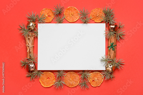 Blank card and Christmas decor on red background