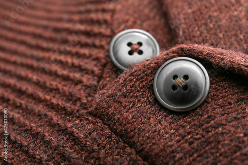 Closeup view of buttons on warm sweater