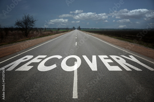 Start to live without alcohol addiction. Word RECOVERY on asphalt highway