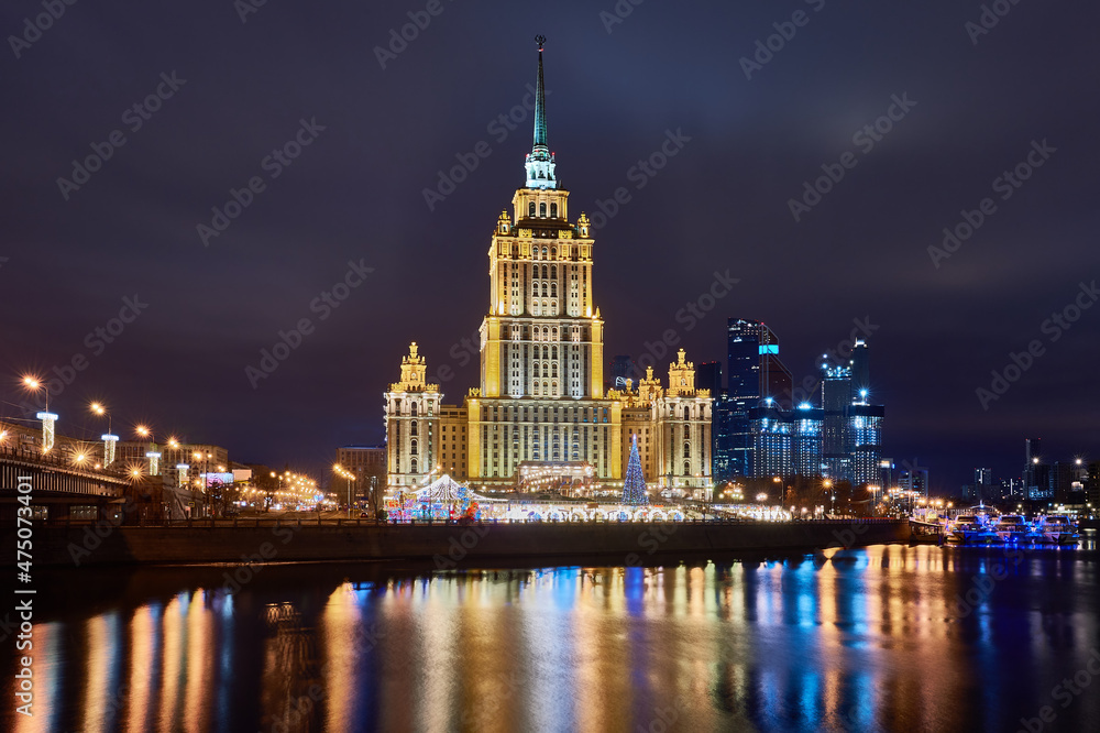 Christmas Moscow. Embankment in capital of Russia. New Year's decorations on Moscow embankment. Russian city in Christmas illumination. Moscow river on a winter nigh Christmas Moscow. Embankment in capital of Russia. New Year's decorations on Moscow embankment. Russian city in Christmas illumination. Moscow river on a winter nigh