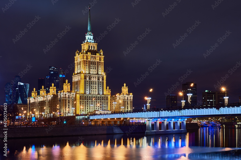 Christmas Moscow. New Year's decorations on Moscow embankment. Russian city in Christmas illumination. Moscow river on a winter night