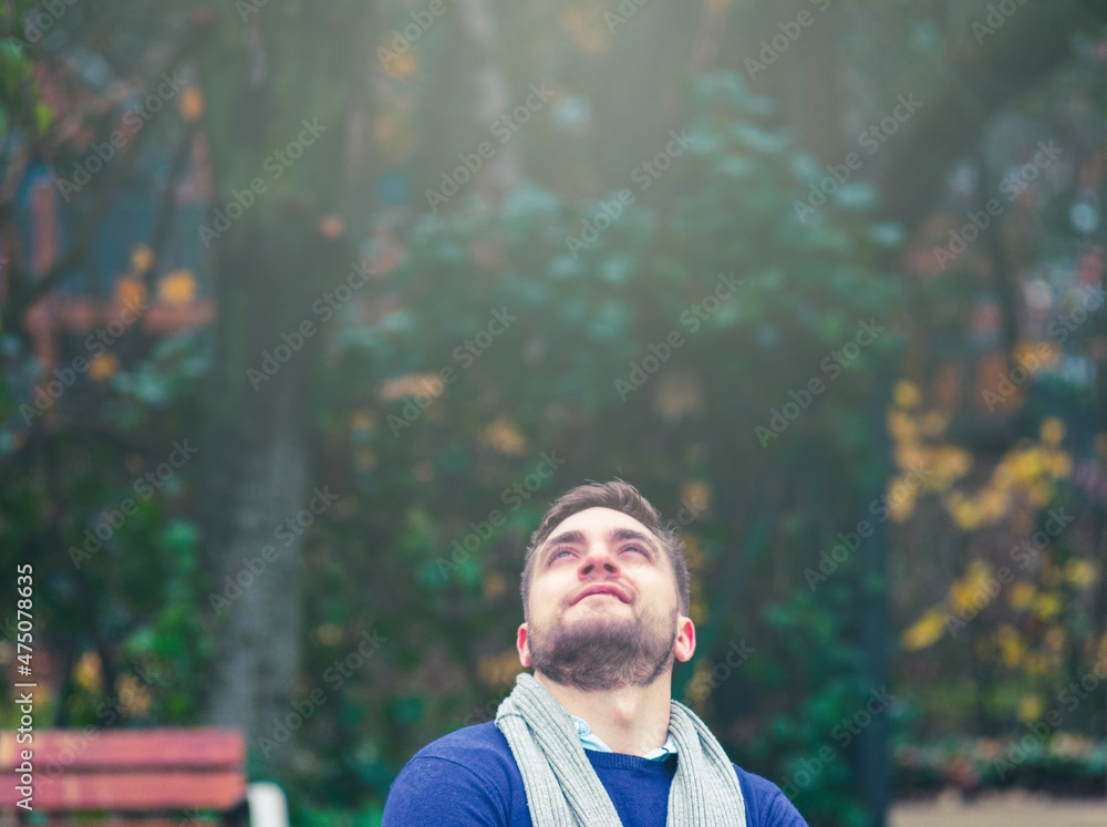 young blond male with short hair and beard looking upwards young blond male with short hair and beard looking upwards