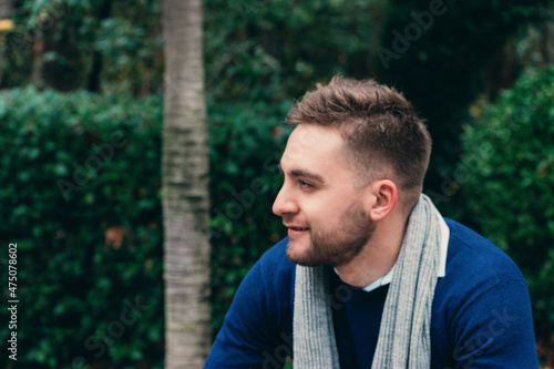 portrait of young blond man with short hair and beard