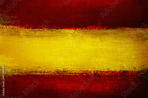 Grunge background in colors of spanish flag photo