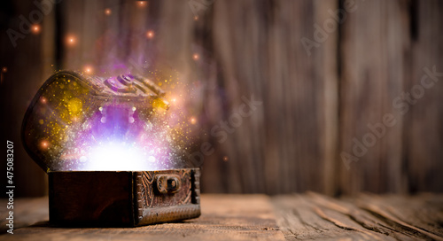 Fotografie Old chest with magic lights inside