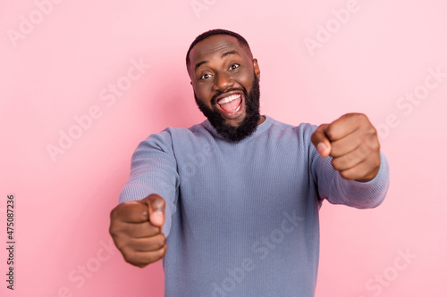 Obraz na plátne Photo of funny taxi driver guy hands hold imaginary steering wheel wear grey shi