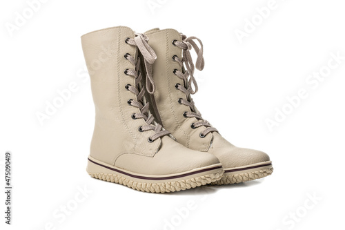 boots with high lacing. winter beige women's boots with lacing. isolated on white background