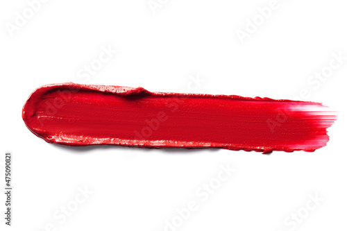 Red smudged lipstick swatch isolated on white background.