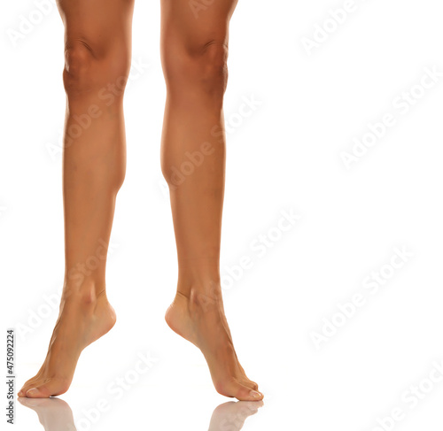 Front view of a beautiful female barefoot legs