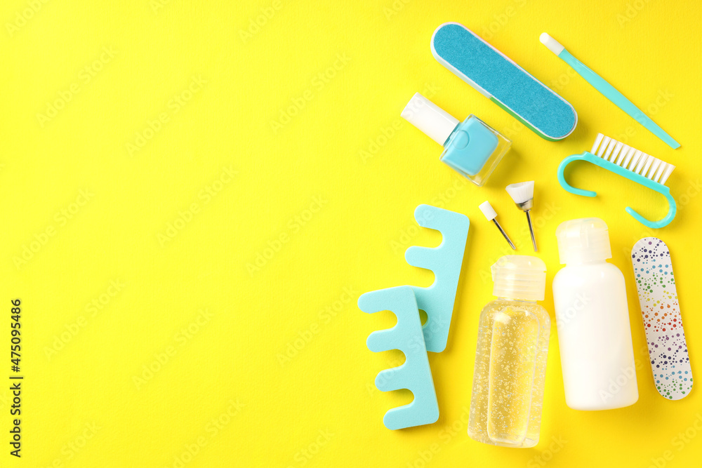 Concept of nail care with manicure accessories on yellow background Concept of nail care with manicure accessories on yellow background