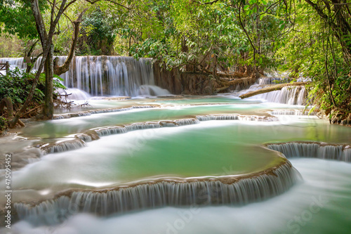 Nature background  The Tat Kuang Si Waterfalls or alternatively known as Kuang Xi Falls  The waterfalls are a favorite side trip in Luang Prabang and begin in shallow pools atop a steep hillside  Laos