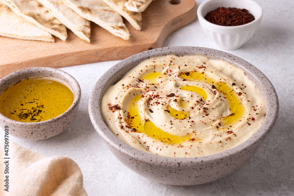 Chickpea hummus seasoned with olive oil and paprika. Chickpea hummus seasoned with olive oil and paprika.