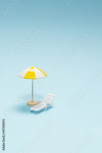 Wallpaper Mural Travel concept. Sun lounger, yellow umbrella on a blue background. Torontodigital.ca