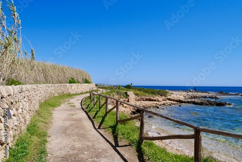 Coastal trail with typical dry stone wall in Riserva Naturale Oasi Faunistica di Vendicari, province Syracuse, Sicily, Italy. photo