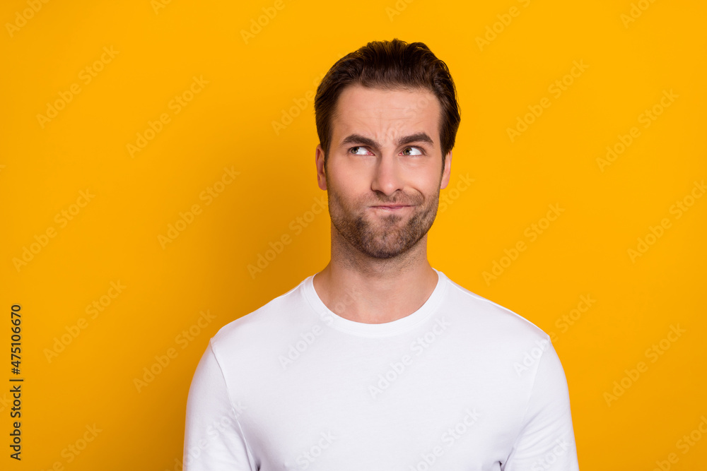 Photo of millennial strict brunet guy look promo wear white sweater isolated on vivid yellow color background Photo of millennial strict brunet guy look promo wear white sweater isolated on vivid yellow color background