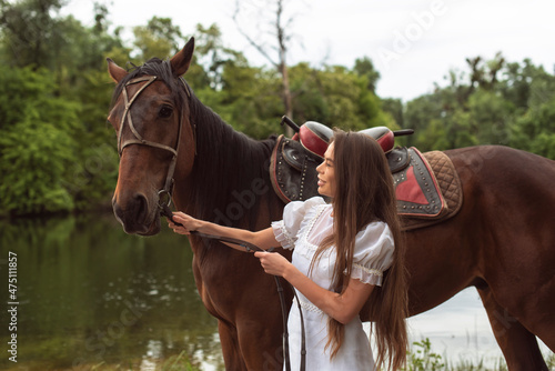 Walk with a horse near the river