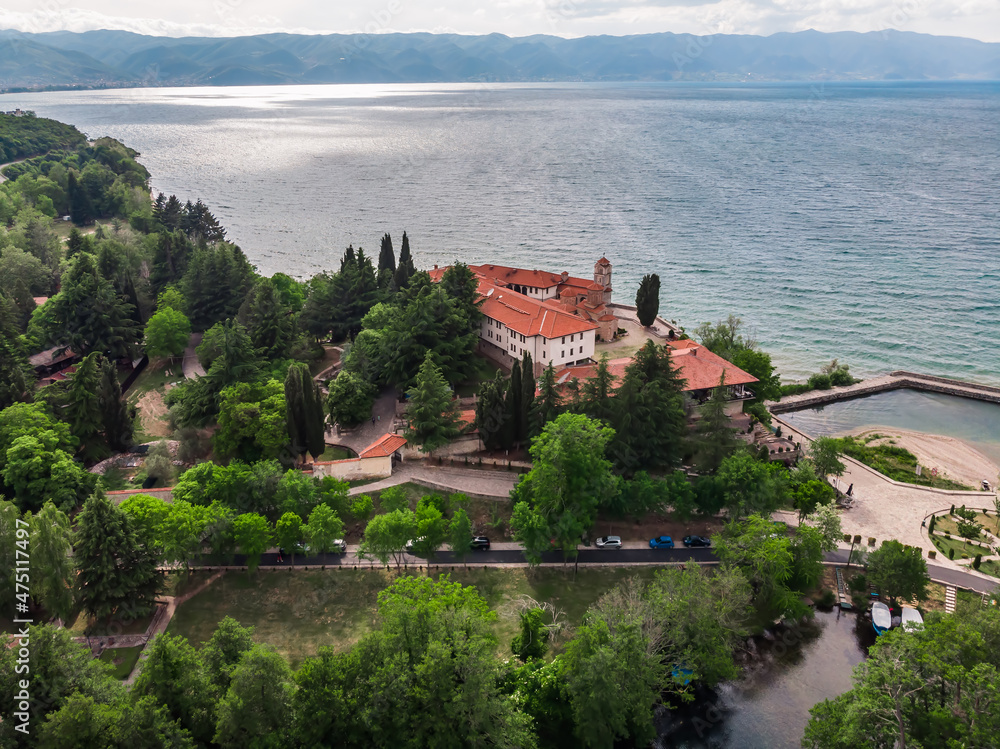 Drone shot of the monastery of St. Naum. An Orthodox monastery in North Macedonia drone view. Monastery of St. Naum on a hill near Lake Ohrid. Green hilly mountains in Macedonia.