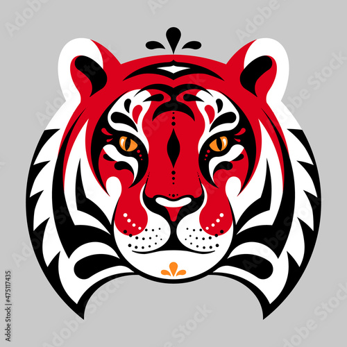 Tiger head. Graphic abstract tiger face. Geometric abstract animal for poster, background, emblem, mascot. Concept of safari, jungle, zoo. Symbol of the Chinese horoscope. Calm muzzle, red color.