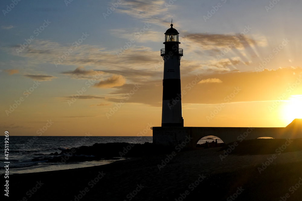 Sunset in one of the most by the sights of the city of Salvador, lighthouse of Itapuã, bahia, brazil